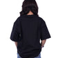 Person wearing a black oversize t-shirt