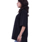 Person wearing a black oversize T-shirt