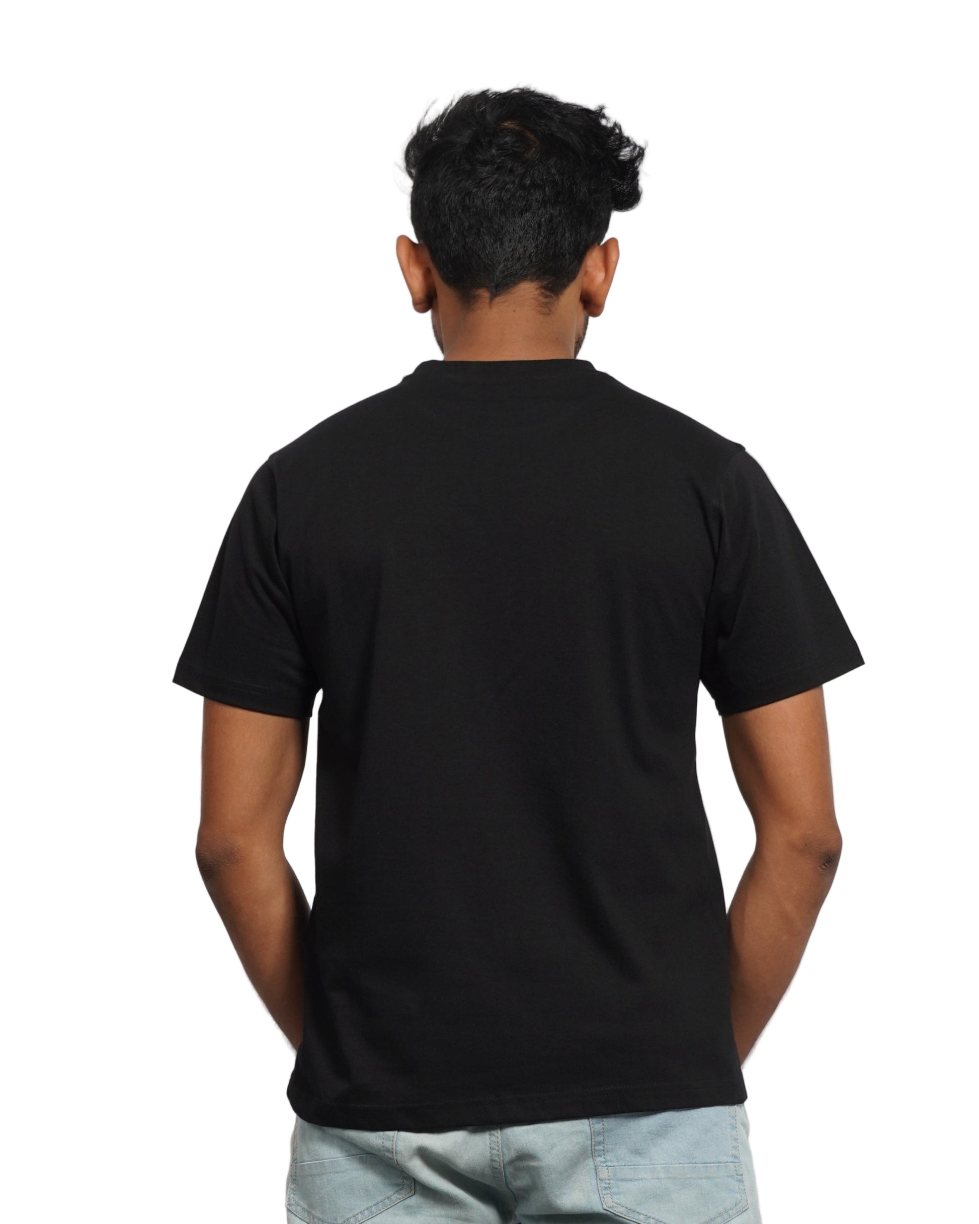 Person wearing a black shirt and jeans on a background