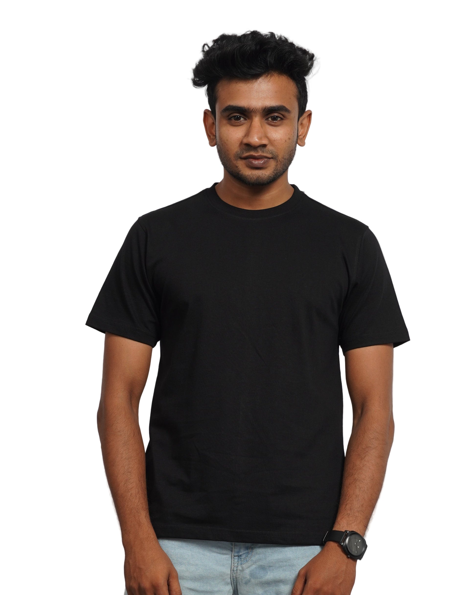 Person wearing a black shirt and jeans on a background