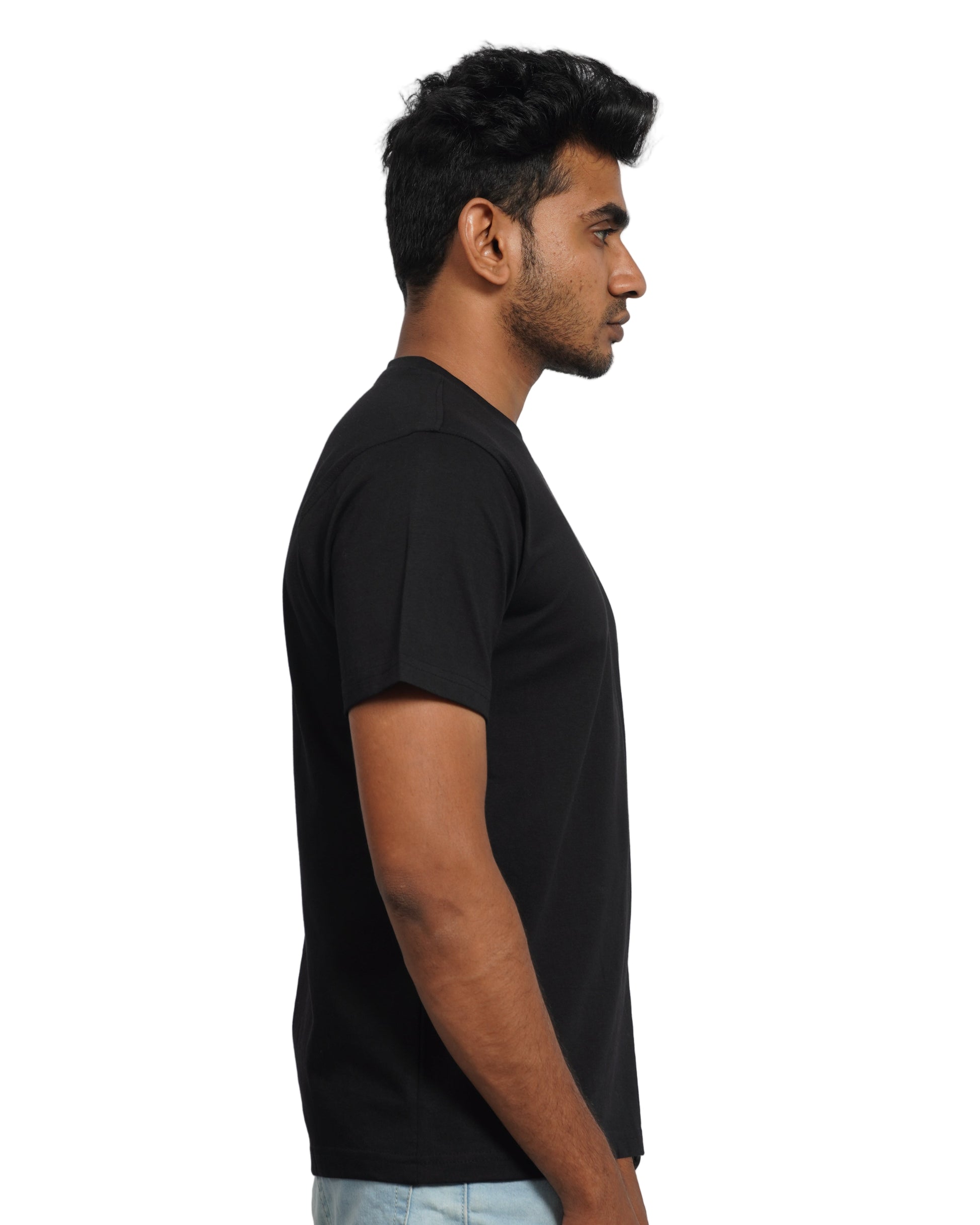 Person wearing a black shirt and  pants with a background