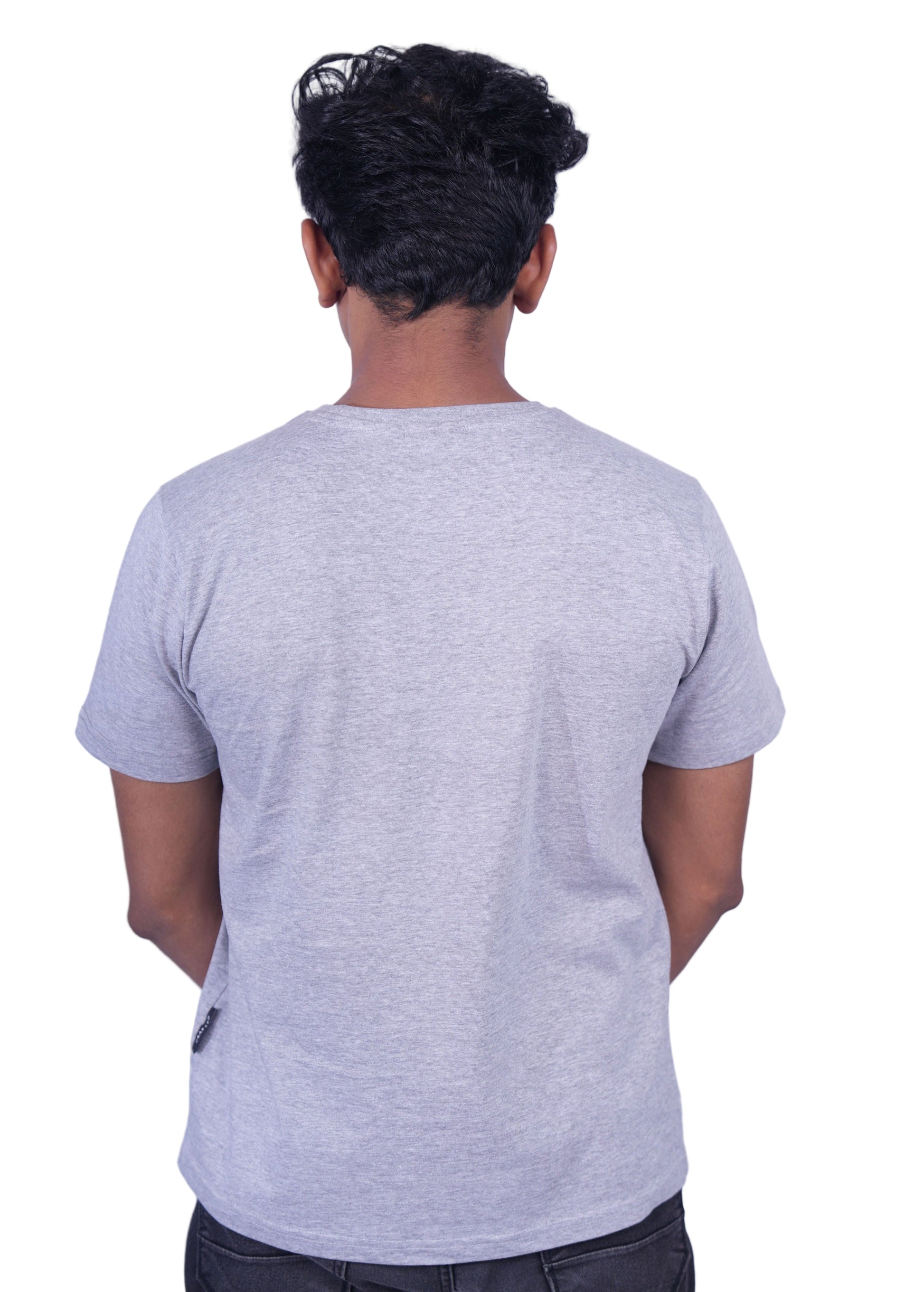 Person wearing a gray T-shirt and pants on a background