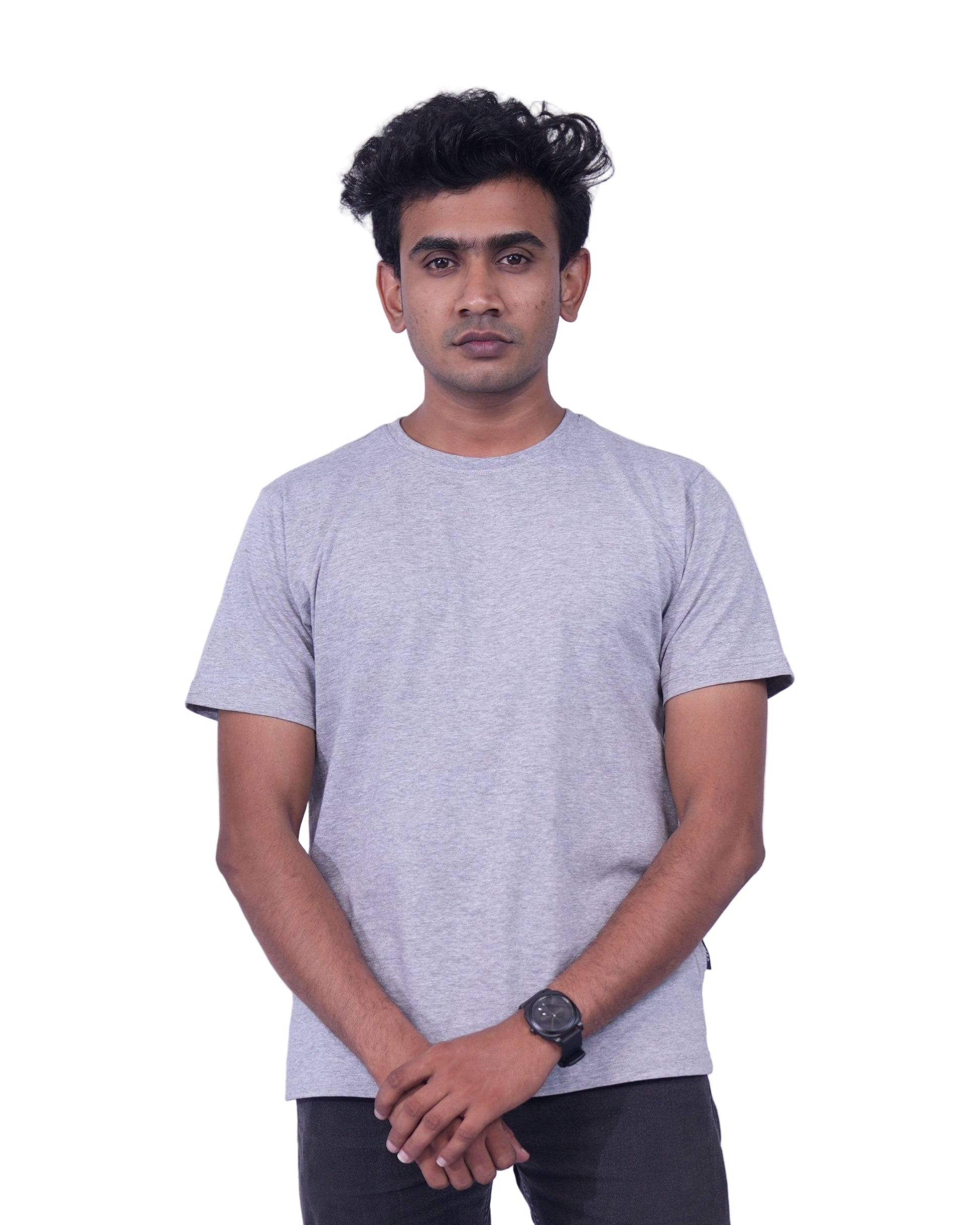Person wearing a gray t-shirt and  pants on a background