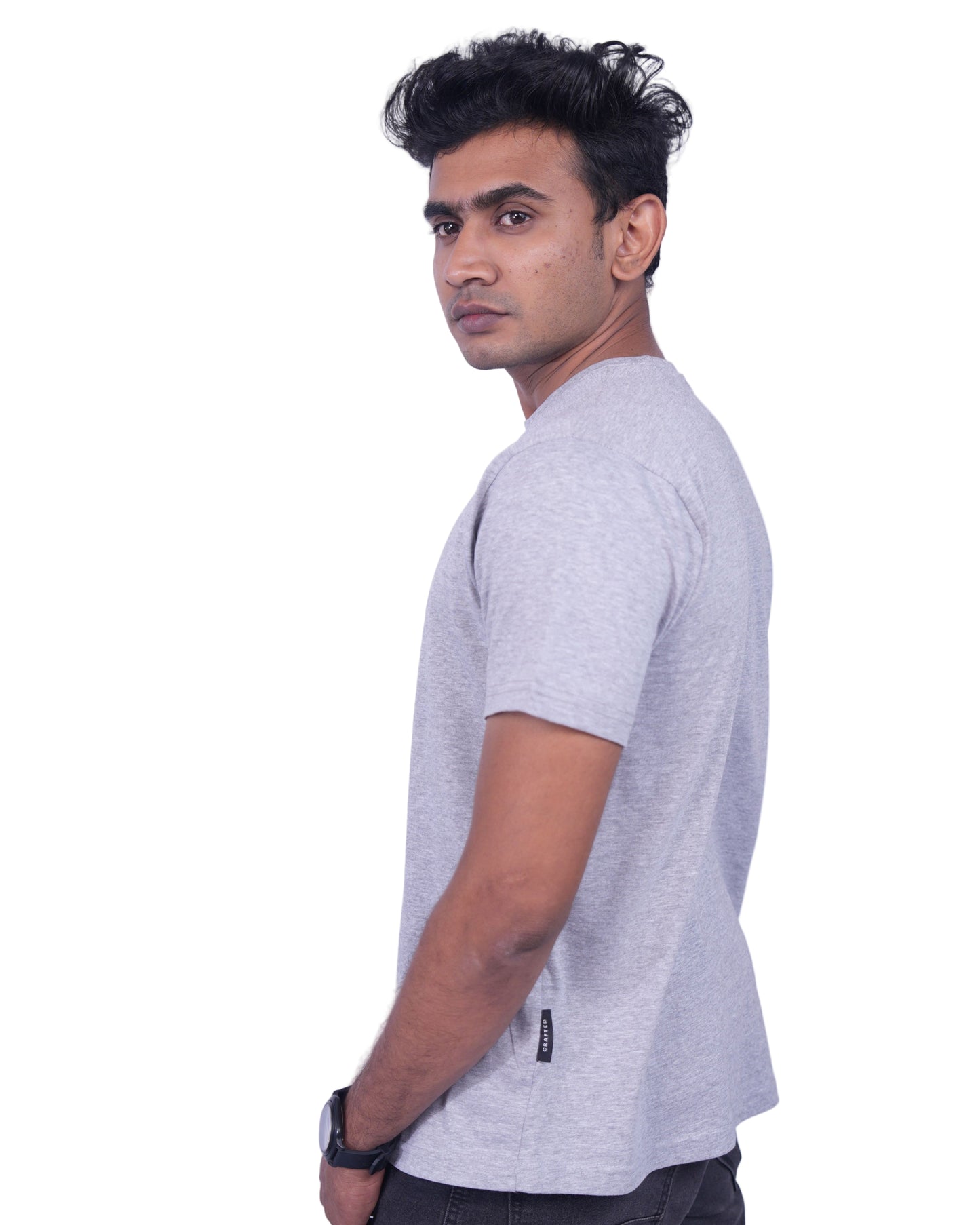 Person wearing a gray shirt andpants on a  background