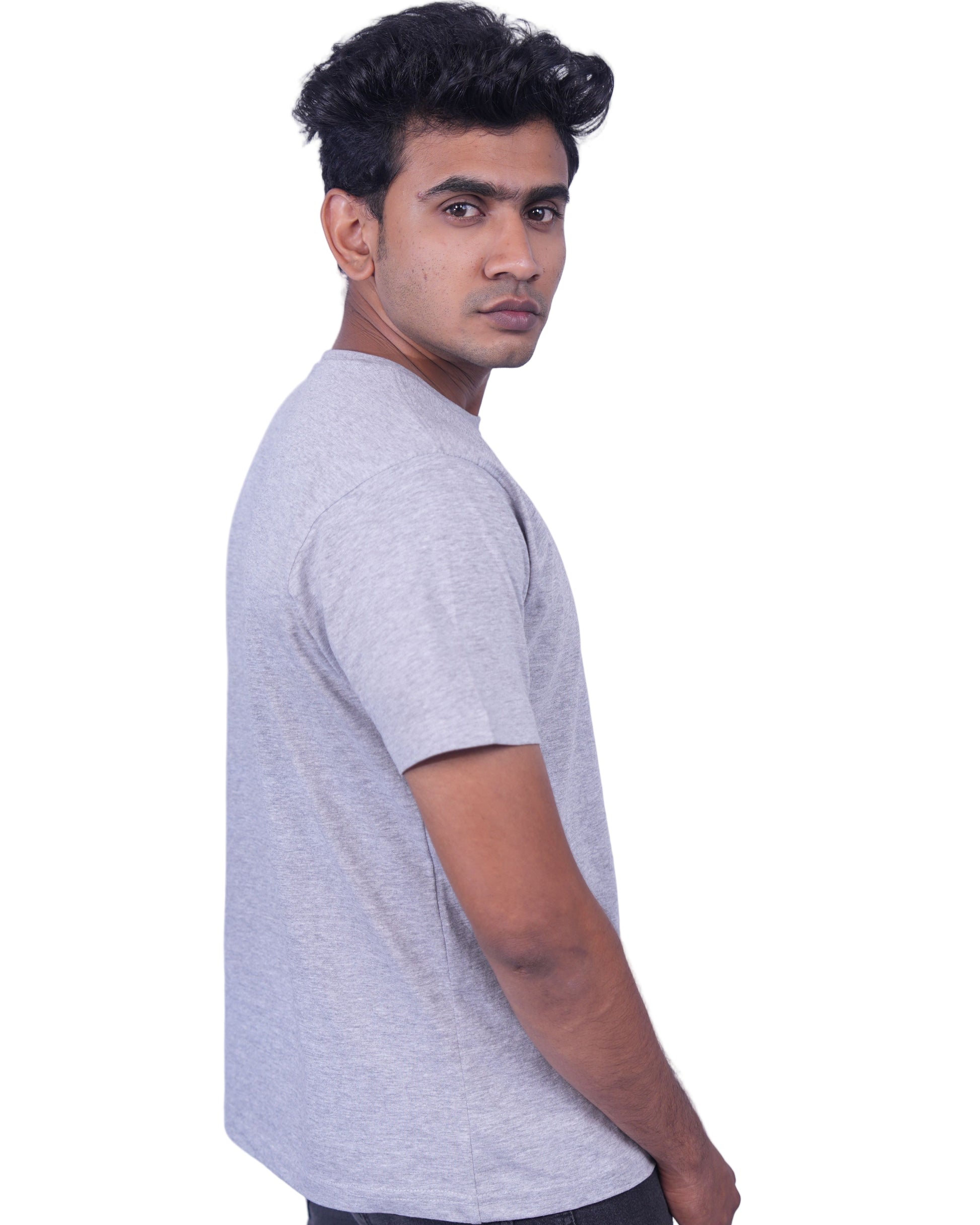 Person wearing a  gray T-shirt on a  background