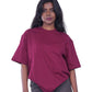 Person wearing a Maroon oversize t-shirt 