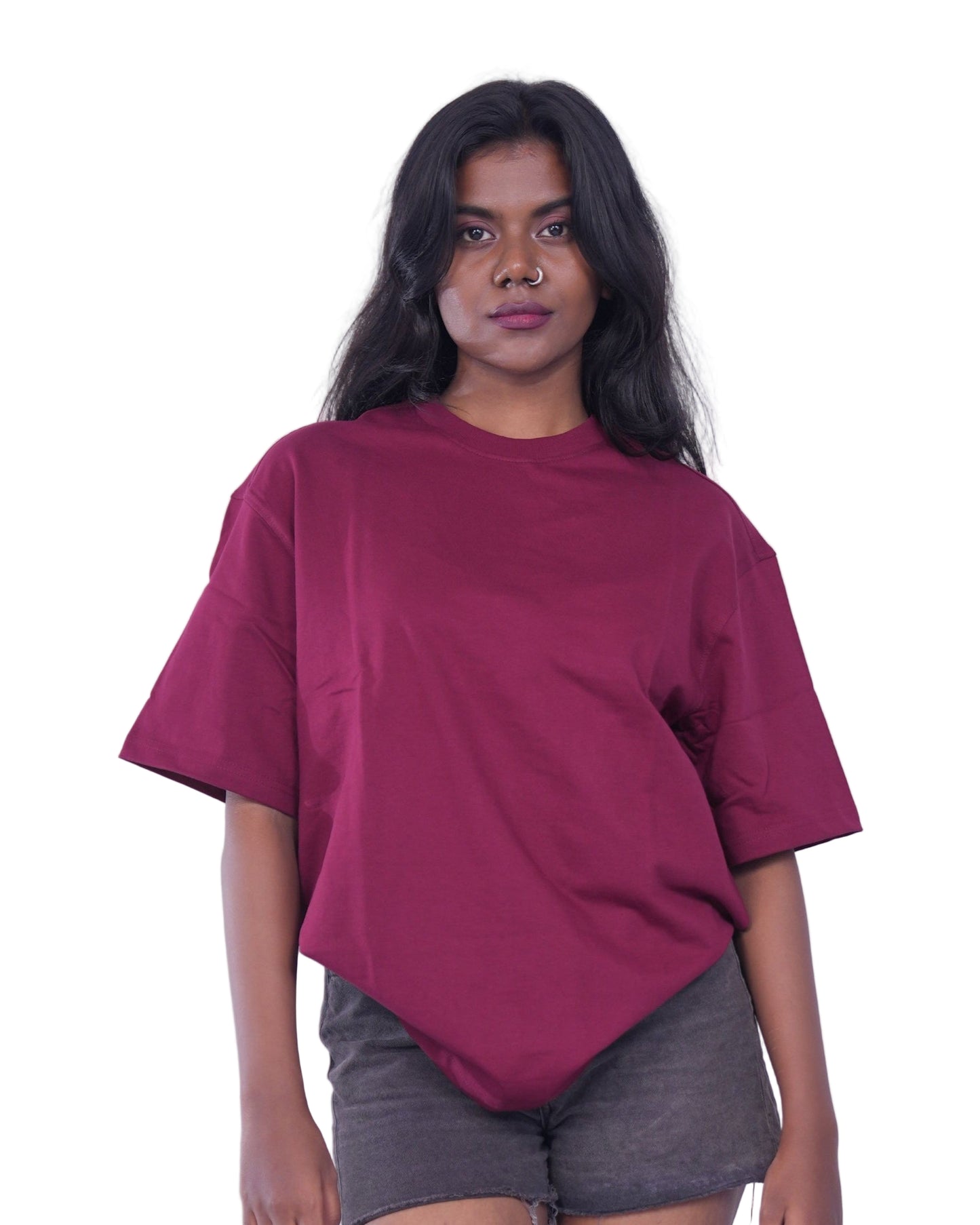 Person wearing a Maroon oversize t-shirt 