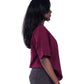 Person wearing a Maroon oversize t-shirt 