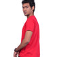Person wearing a red shirt and black pants on a white background