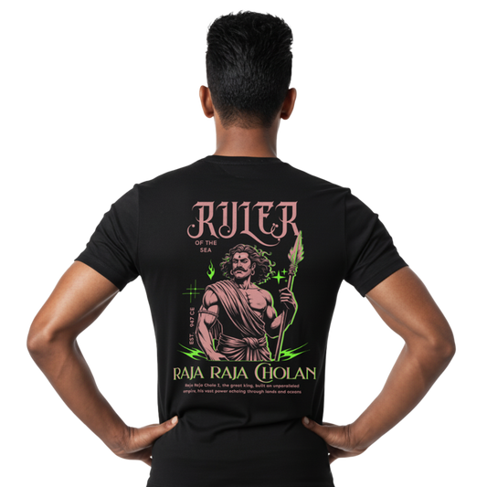 Back view of black “Raja Raja Cholan the Ruler of the Sea” T-shirt with large Raja Raja Cholan illustration and Ruler of the Sea typography graphic on male model, regular unisex fit by Crafted Community