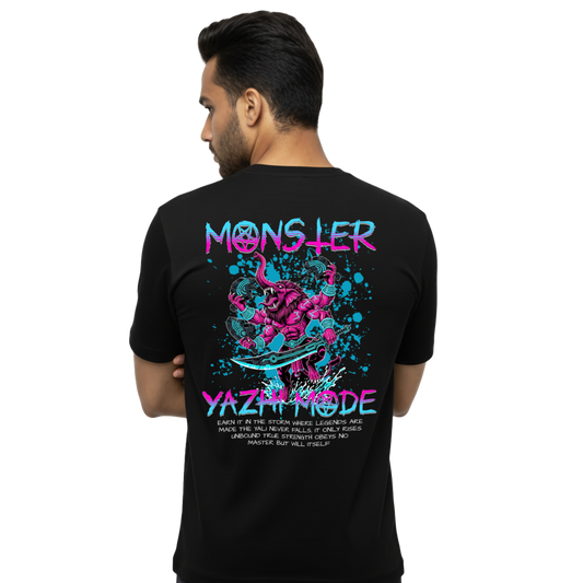 Back view of black “Monster the Yazhi Mode” T-shirt with large neon Yazhi creature illustration and Monster Yazhi Mode typography graphic on male model, regular unisex fit by Crafted Community