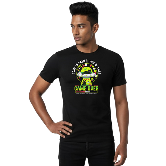 Front view of black “Come In Gamer, You’re Lost – Game Over Cat UFO Tee” on male model with central UFO and cat gaming graphic, unisex regular fit T-shirt by Crafted Community