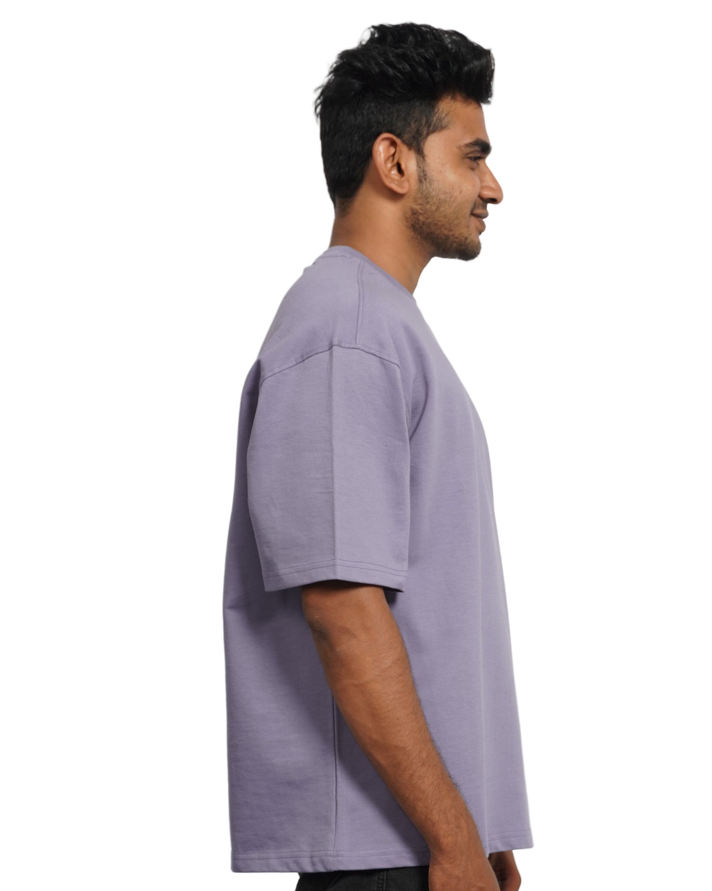 Person wearing a lavender oversize t-shirt