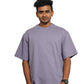 Man wearing a lavender oversize t-shirt 