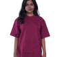 Woman wearing a maroon oversize t-shirt