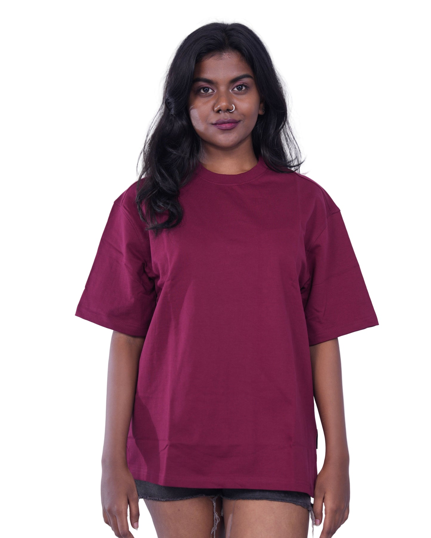 Woman wearing a maroon oversize t-shirt